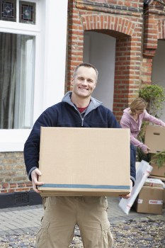 Loading household furniture into a van for a move in Sutton