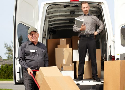 Furniture and boxes being loaded into a moving truck