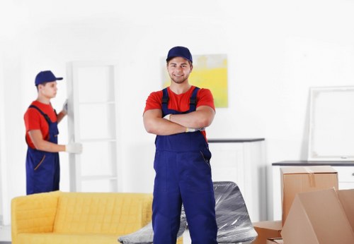 Professional movers loading items into a van in Sutton