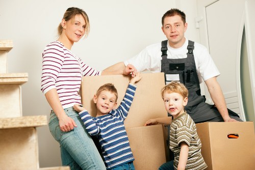 Professional movers handling furniture in a Sutton property