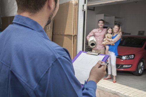 Moving van outside a Sutton flat building with access considerations
