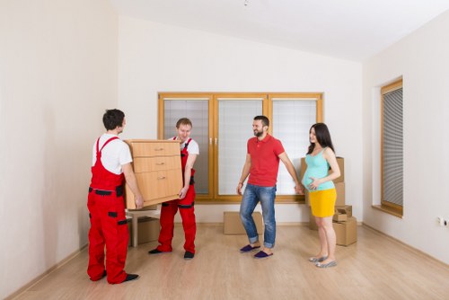 Loading household furniture into a van for a Sutton relocation