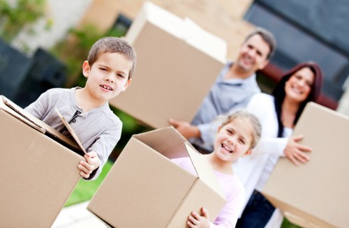 Packed boxes and furniture ready for an apartment removal in Sutton