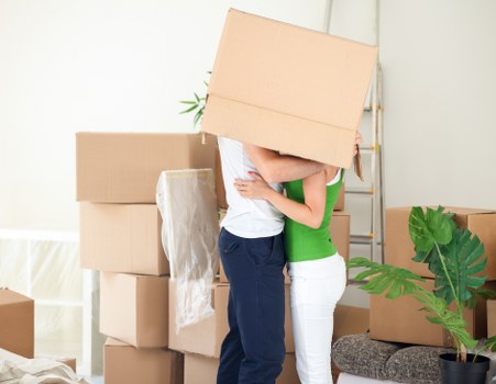 Local office moving team handling desks and equipment for a Sutton business