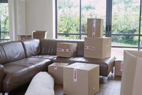 Removalists carefully packing household items for a local Sutton move